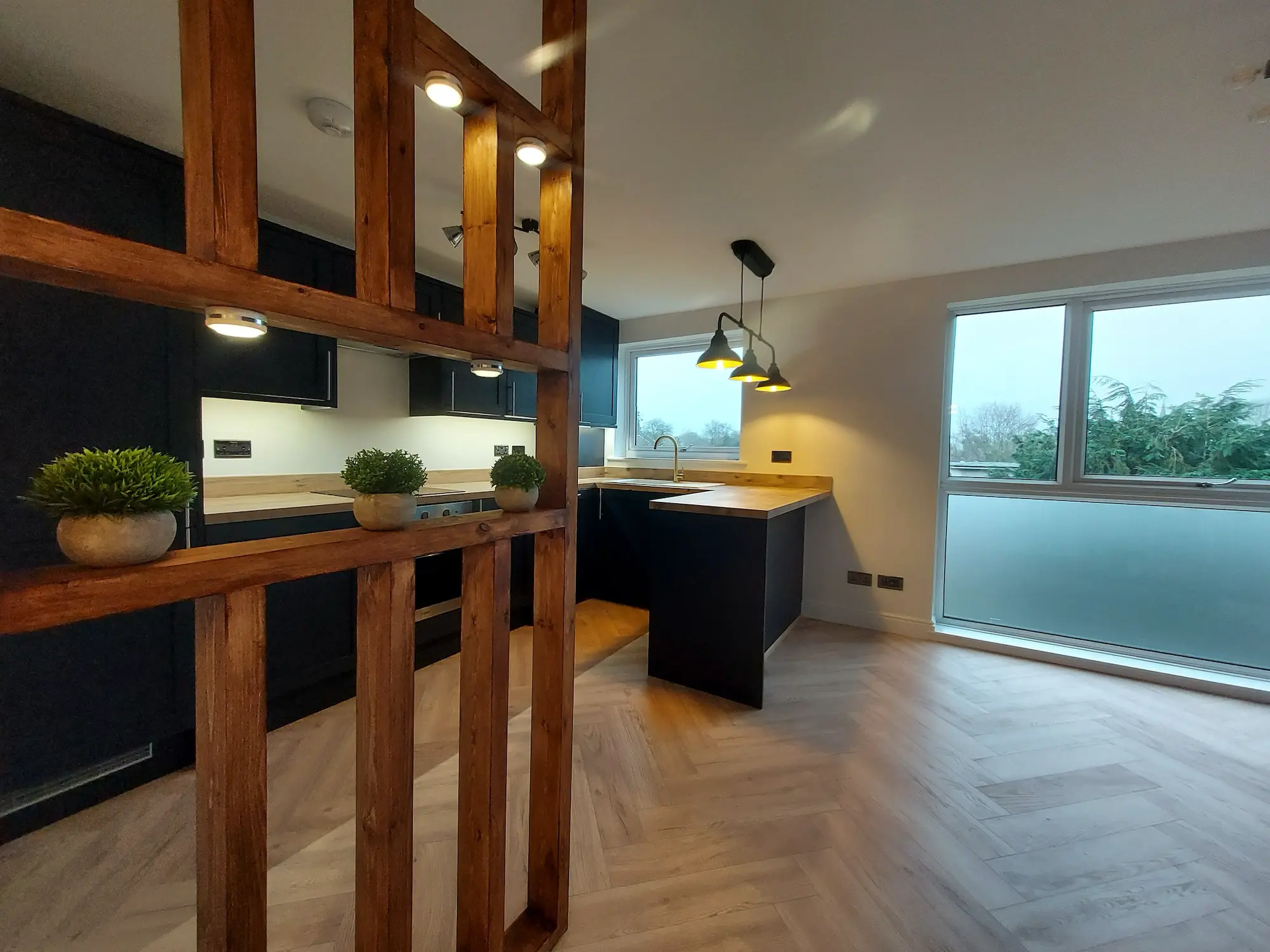 Photo of the modern, stylish living room and kitchen of Wren Court 2 Bedroom Flat